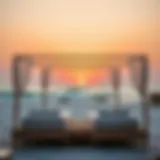 Luxury sunbed setup on JBR Beach with vibrant sunset