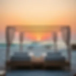 Luxury sunbed setup on JBR Beach with vibrant sunset
