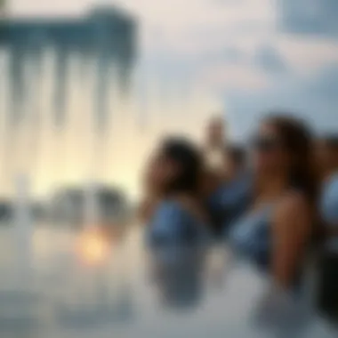 Visitors enjoying the spectacle of the Pointe Water Fountain